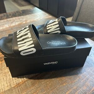 Like new Authentic Valentino slides, comes with box. Size 8